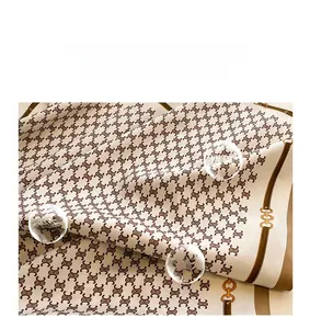 Detail of soft twill silk scarf showing vintage patterns and premium smooth texture