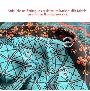 Macro shot of faux silk fabric with geometric floral patterns and breathable water droplets