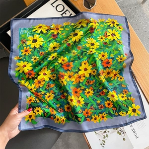 Elegant mulberry silk square scarf with vibrant sunflower prints on a wooden background