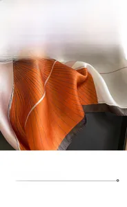 Detailed close-up of fine hemmed edges and orange striped silk fabric texture