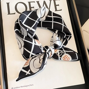 Elegant silk square scarf featuring camellia pattern and black-white checkered design