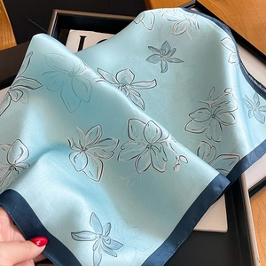 Elegant light blue silk square scarf with white magnolia print and dark blue border