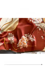 Detailed view of the fine rolled edge stitching on a mulberry silk floral scarf