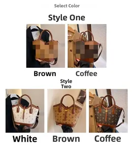 Detail view of large printed tote bags showing contrast panels and wide logo straps