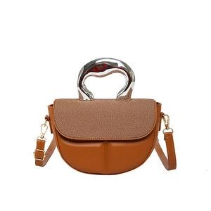 Brown saddle handbag with woven texture cover and sculpted silver metallic handle