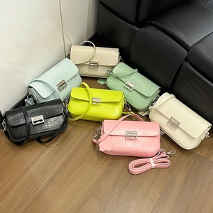 Chic small square crossbody bags in vibrant colors with metallic locks and flower charms