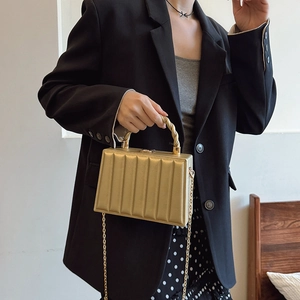 Elegant gold vertical textured box bag with top handle and gold chain strap for women