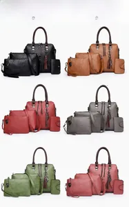 Detail view of 4-piece handbag set in six colors with cat hardware and tassel charms