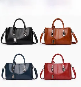 Collage of large oil wax leather tote bags in black, brown, dark blue, and red colors