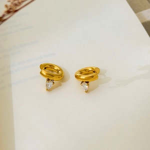 Detail of 18K gold-plated hoop earrings featuring clear pear-cut zircon drops