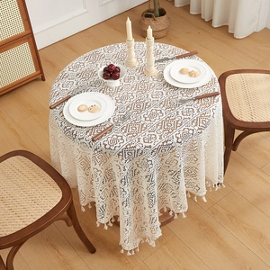 White vintage crochet lace tablecloth with tassels for round dining table setting