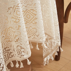 Retro American beige crochet lace tablecloth with hollow patterns and fringe details