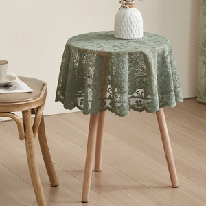 Macro detail of French pastoral lace tablecloth with floral hollow patterns and wavy edges