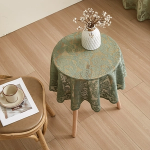 French country round green lace tablecloth with elegant floral embroidery and ruffled edge