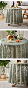 Close-up of sage green lace tablecloth featuring vintage floral embroidery and scalloped edges