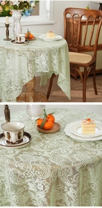 Close-up of vintage French lace tablecloth with intricate floral hollow-out embroidery
