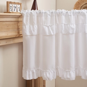 Detail of white tiered ruffle cafe curtains with semi-sheer fabric and rod pocket