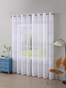 Close-up of white lace sheer curtains featuring vintage jacquard patterns and metal eyelets