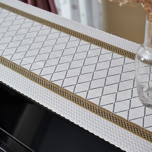 Modern white table runner with black diamond pattern and gold hollow lace decoration