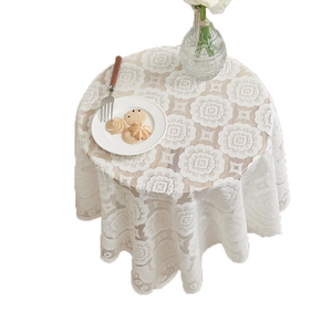 Elegant white lace tablecloth with floral patterns and scalloped edges for round tables