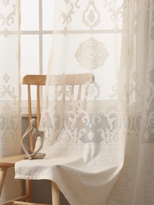 Detailed embroidery and wide lace edge on ivory vintage sheer curtain for living room