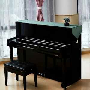 Dark green cotton linen piano cover with golden geometric patterns and white tassels