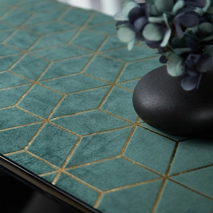 Green velvet table runner with gold geometric diamond patterns for modern home decor
