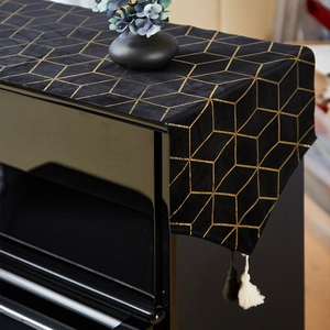 Modern black piano cover with gold geometric patterns and decorative tassels