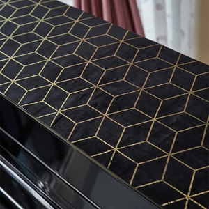 Black velvet furniture cover with gold geometric patterns for piano top and tables