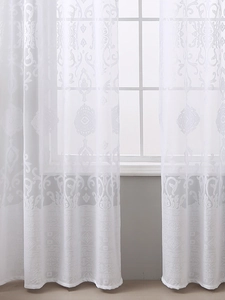Detail of white semi-transparent lace curtain with damask floral jacquard patterns