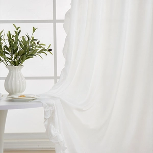 Elegant white velvet curtains with ruffled edges for a modern minimalist living room