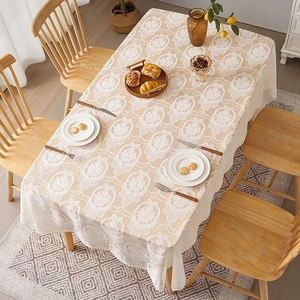 Detailed close-up of French vintage butterfly lace tablecloth with floral patterns