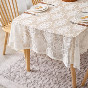 French vintage white butterfly lace tablecloth with elegant floral pattern on wooden table