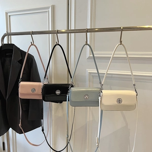 Minimalist rectangular crossbody bags in pink, black, blue, and white with silver metal clasps