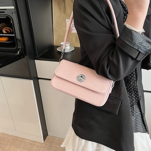 Pink patent leather rectangular crossbody bag with silver twist lock on shoulder strap