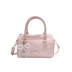Pink snakeskin pattern boston bag with pearl bow charm and adjustable strap