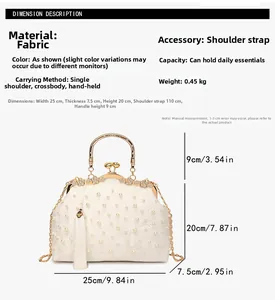 Detail view of white pearl embroidery and floral patterns on shell-shaped luxury handbag