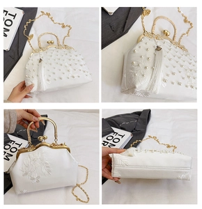 Detail shots of white pearl evening bag with lace embroidery and gold chain strap