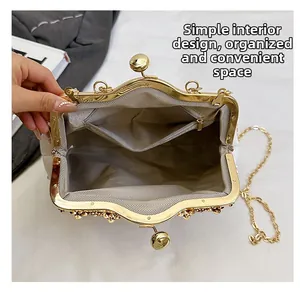 Top view of white pearl evening bag showing interior space with herringbone lining