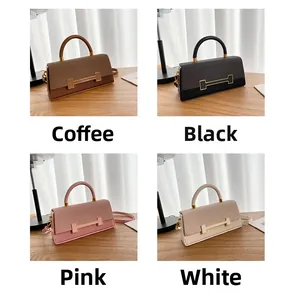 Detail view of stylish crossbody box bags with woven texture and H-shaped gold buckles