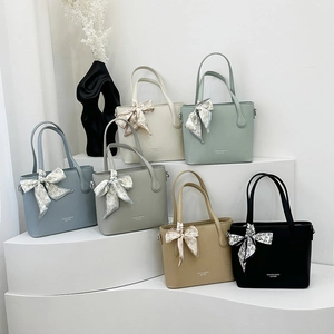 Sac fourre-tout en cuir minimaliste en six couleurs avec foulard décoratif sur la poignée