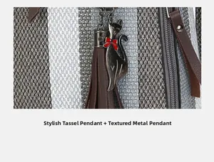 Detail of tweed fabric handbag featuring a black cat charm with red bow and brown tassel