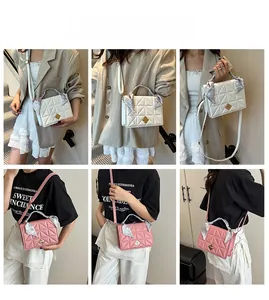 Quilted shoulder bags in pink and white featuring floral scarf handle and gold locks