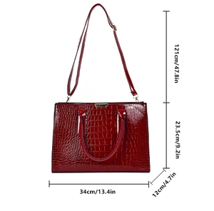 Detail view of burgundy faux crocodile tote bag with dimensions 34cm width and 23.5cm height