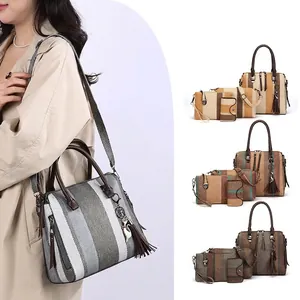 Fashion four-piece handbag set with large tote and cat charm in contrasting colors