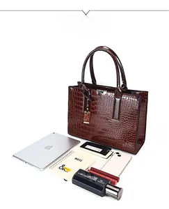 Deep brown crocodile pattern tote bag capacity display with tablet and daily essentials