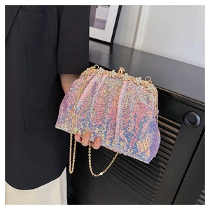 Close-up of pink sequin evening clutch with rhinestone floral clasp and gold chain strap