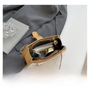 Internal capacity of contrast color chain bag with daily essentials and gold hardware