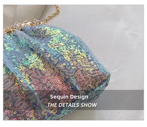 Close-up of evening clutch showing sequins, fine mesh, and rhinestone floral metal clasp