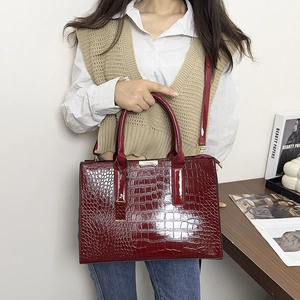 Classic dark red crocodile pattern tote bag with polished finish and shoulder strap